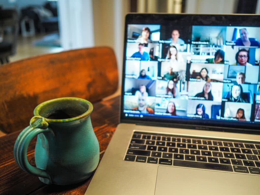 Computer laptop sitting on desk with coffee cup