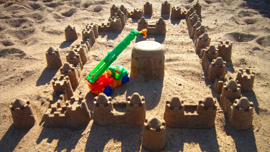 toy crane appears to be building a sandcastle. This is not a scaleable building method.